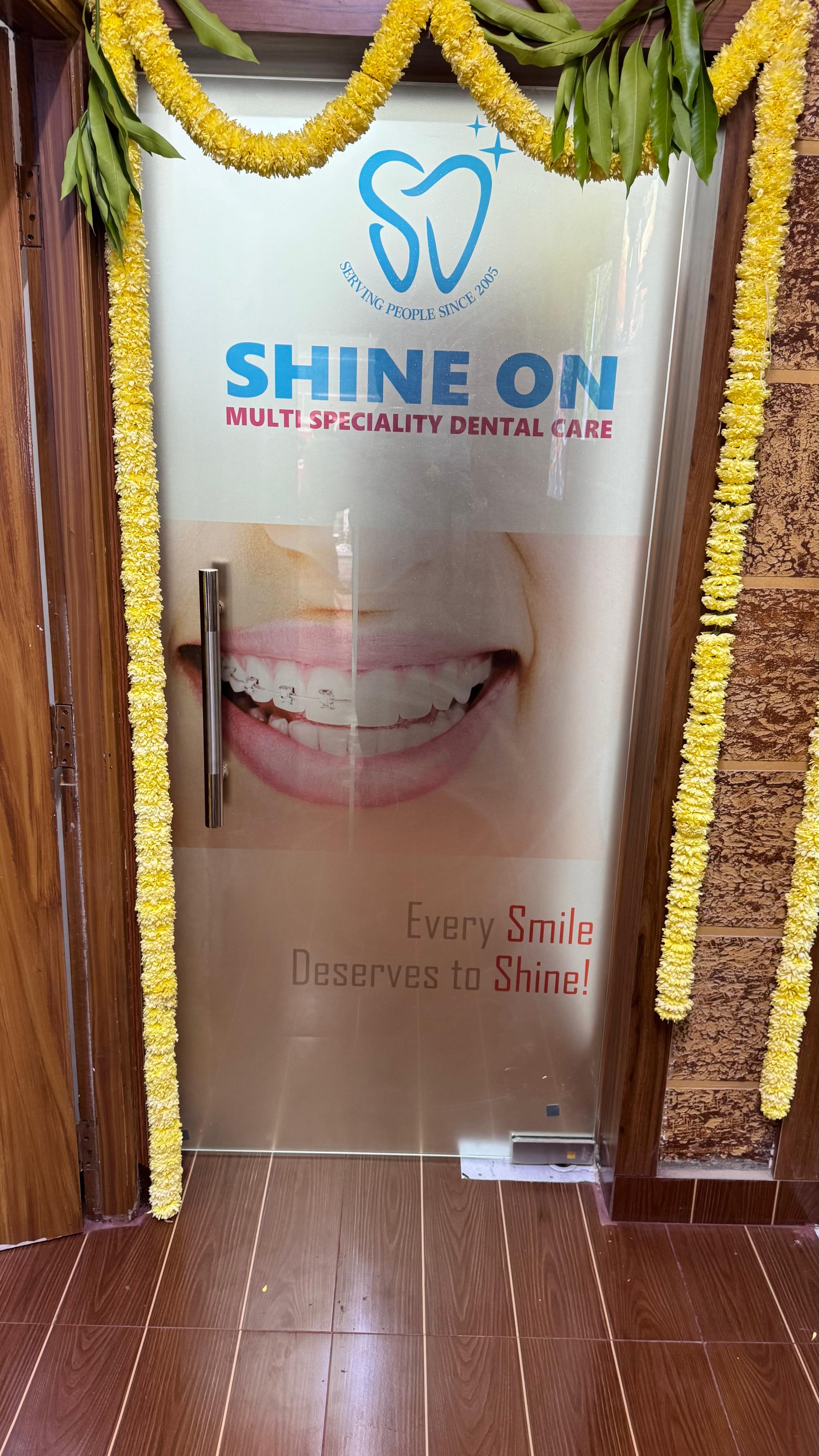 Shine On clinic entrance — branded glass door